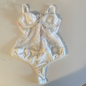 Ivory lace bodysuit.